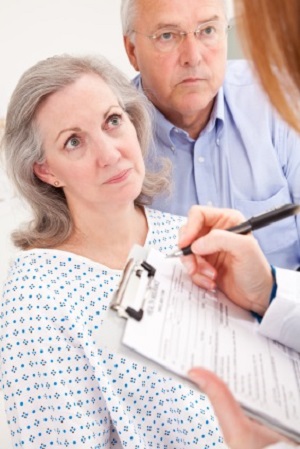 patient and husband talking to doctor