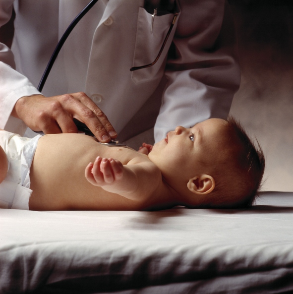 baby being examined by doctor with stethoscope