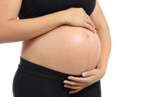 pregnant mother cradles belly