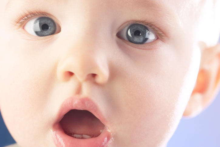 close up of baby's face with open mouth